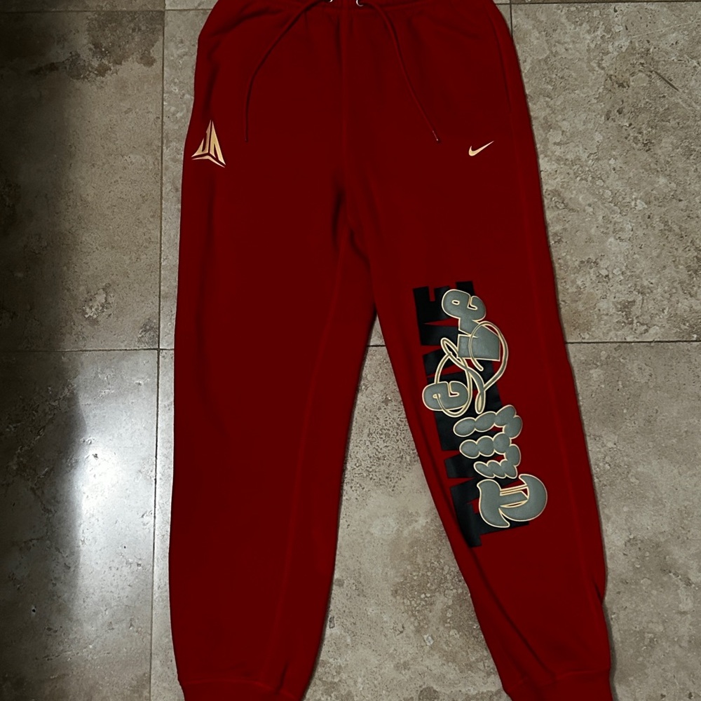 Nike Kids Red Joggers with Graphic Design